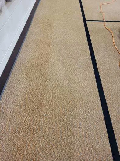 Church gym carpet strip half clean